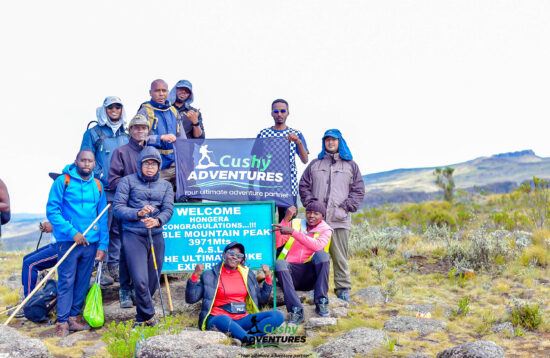 A breathtaking view from atop Table Mountain, Kenya, showcasing the expansive Rift Valley and picturesque Lake Elementaita in the distance.