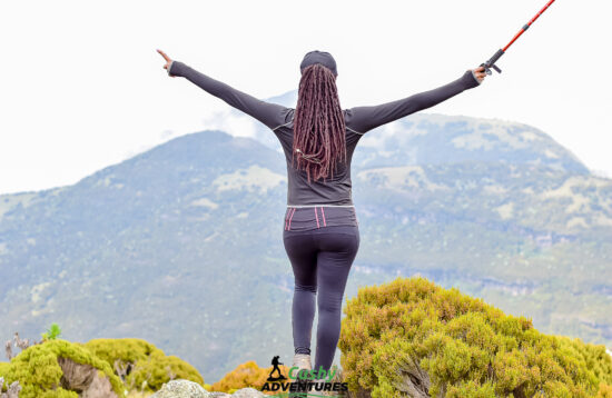 Standing atop Mount Kinangop's summit at 3,906m, surrounded by breathtaking panoramic views and lush moorlands. Embrace the challenge, reach new heights