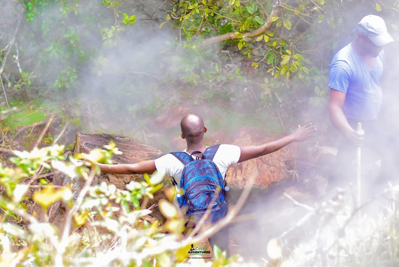 Cushy Community hiker relaxing in Eburru steam.