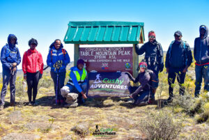 Cushy community hikers standing on Table Mountain summit