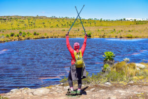 Cushy community hiker posing beside one of the Seven Ponds
