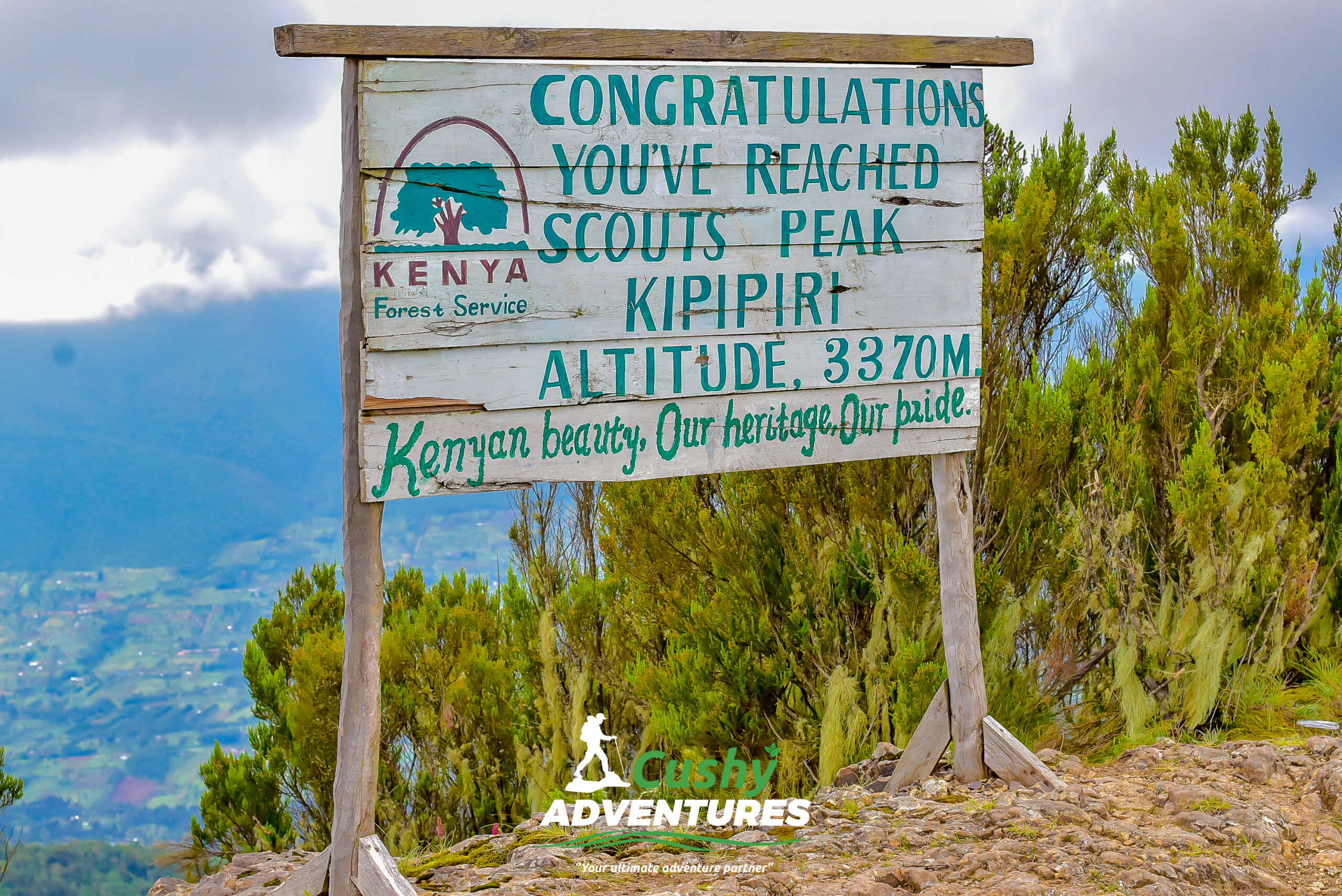 Summit board marking the peak of Mt. Kipipiri at 3,370 meters above sea level.