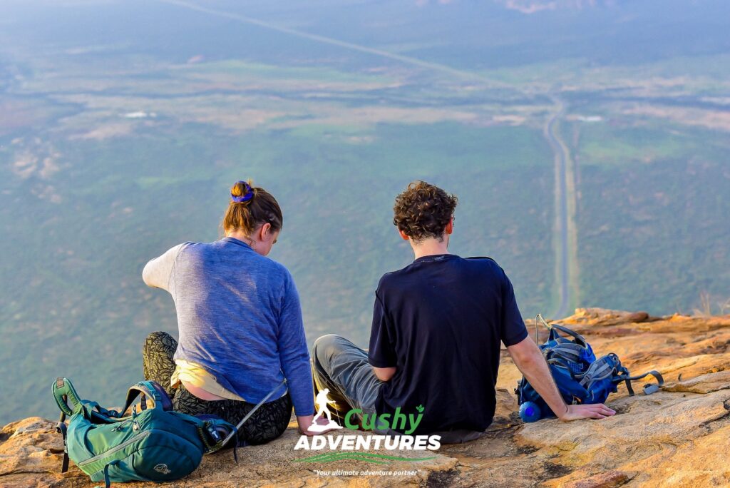 Two tourists enjoying the view at the summit during Mt. Ololokwe Hike and Camping adventure