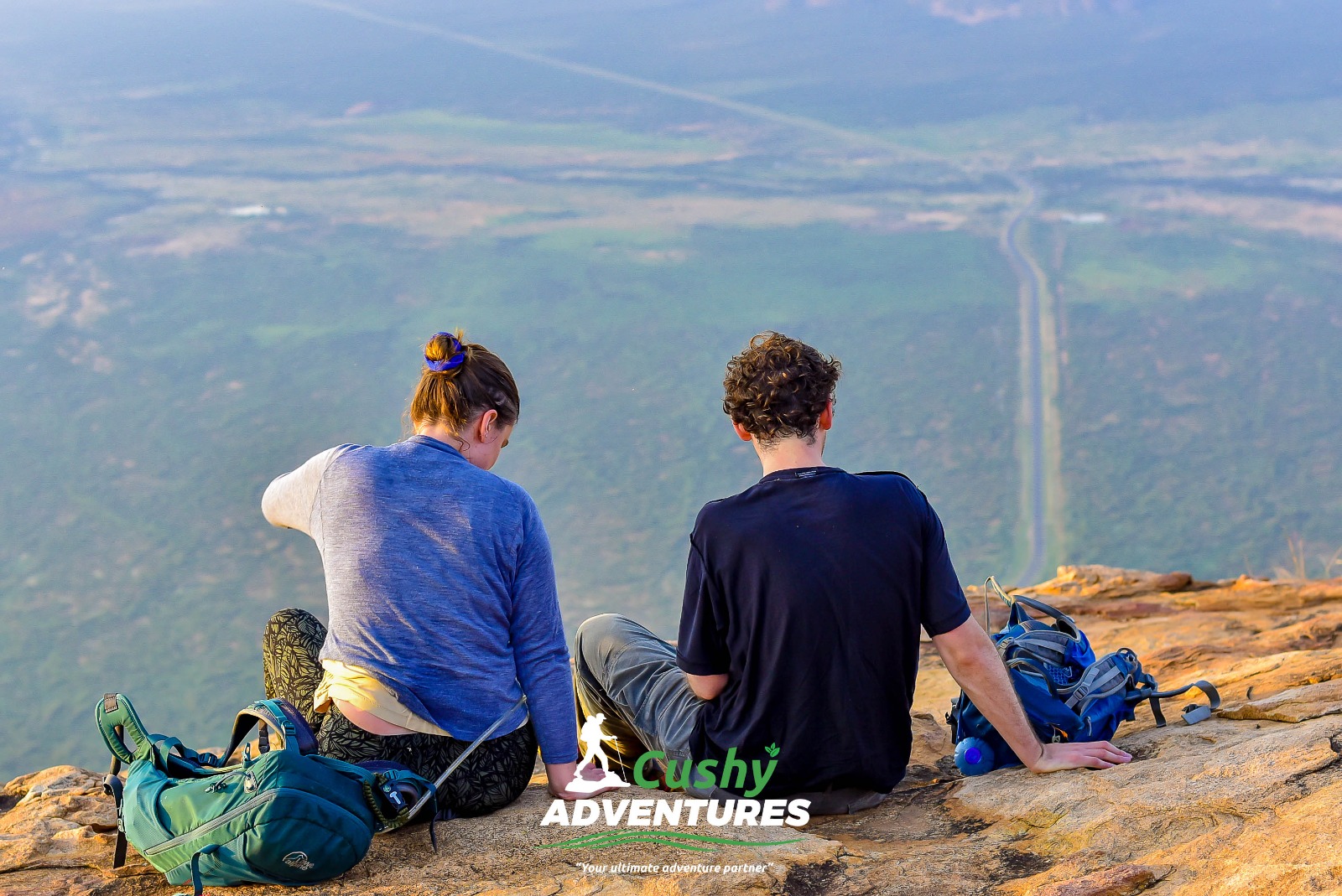 Two tourists enjoying the view at the summit during Mt. Ololokwe Hike and Camping adventure