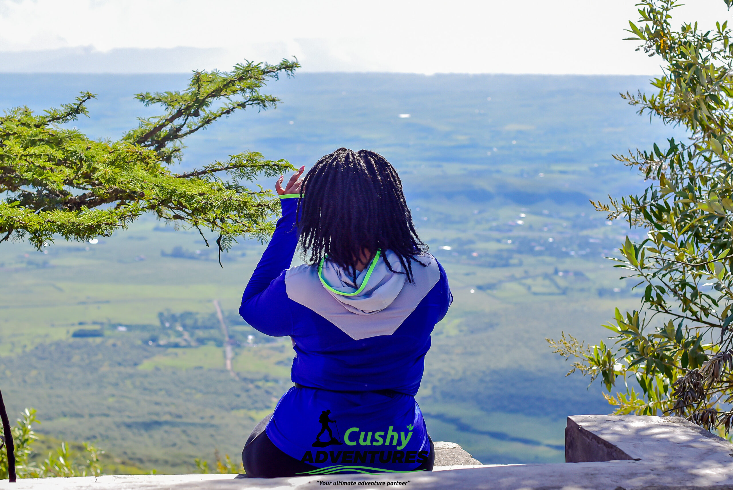 Female hiker resting at Mount Longonot crater rim