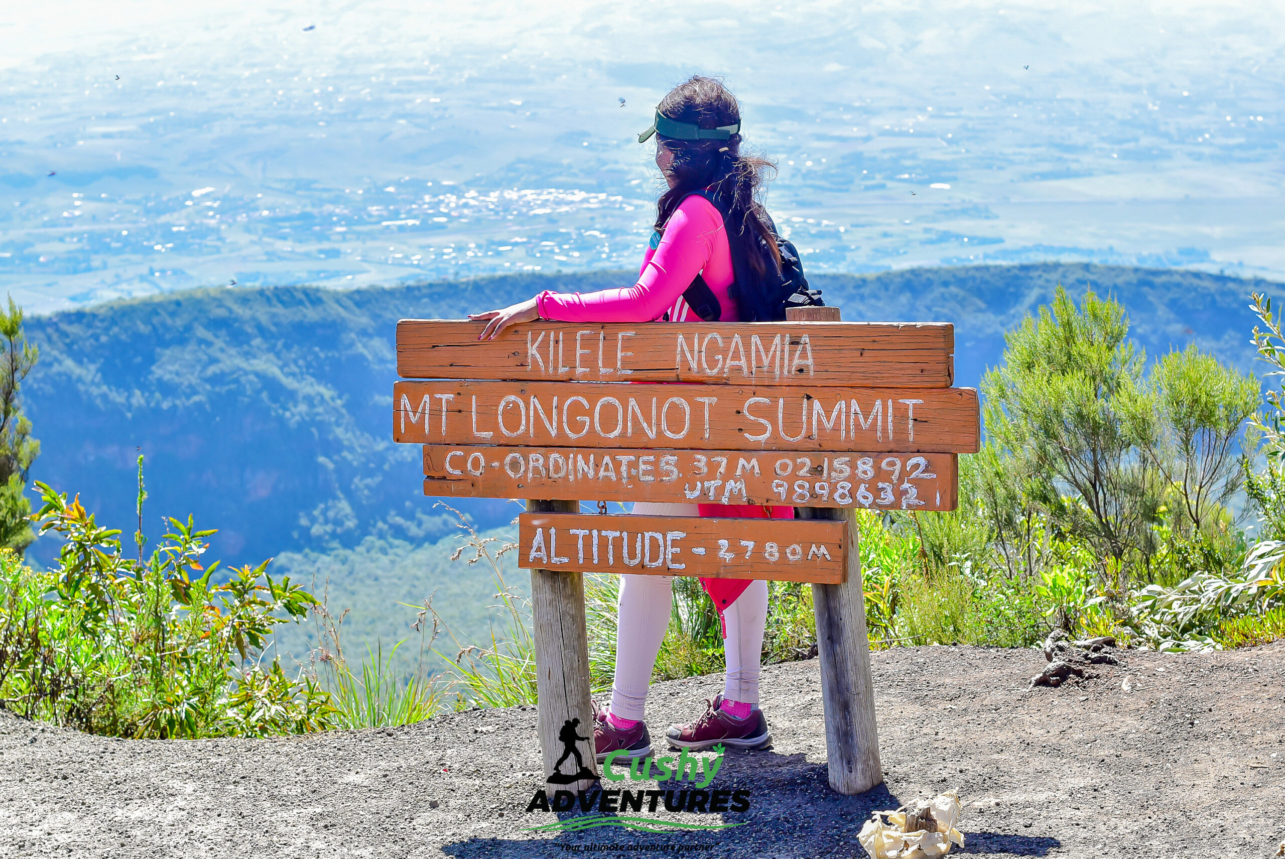 Female hiker at Kilele Ngamia summit board