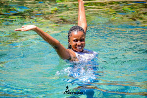 Travelers swimming in the natural Buffalo Springs pool in Samburu
